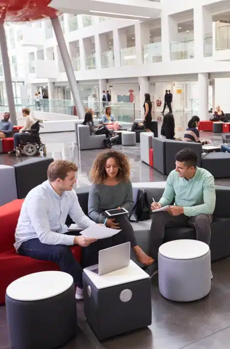 Team reviewing a campus activation plan in a student lounge