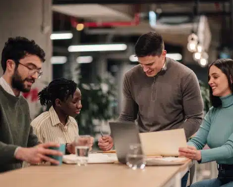 Team reviewing client partnership materials together at a table